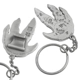 Close up of custom shaped claw style bottle opener. Bottle opener is shaped like a dinosaur foot print. On the back is the claw style hook. 