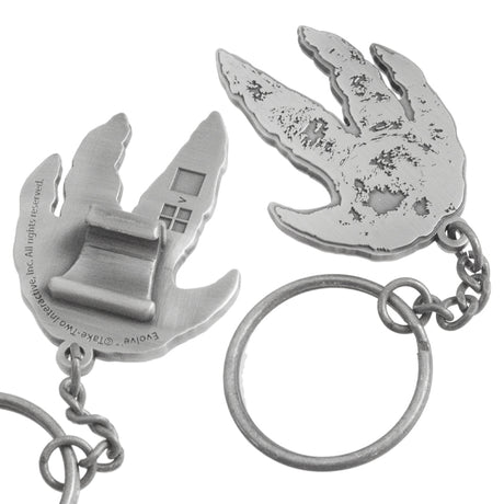 Close up of custom shaped claw style bottle opener. Bottle opener is shaped like a dinosaur foot print. On the back is the claw style hook. 