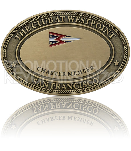 An antiqued bronze oval plate for "The Club at Westpoint," featuring a multicolored flag emblem.