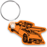 Vinyl / plastic keychain with a black tow truck design on a white background