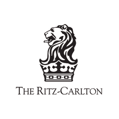 The Ritz-Carlton logo with a lion emblem on a white background