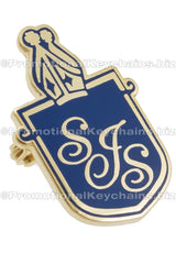Image of custom shaped hard enamel lapel pin. Shape is s shield with crown at top. Gold and blue design. 