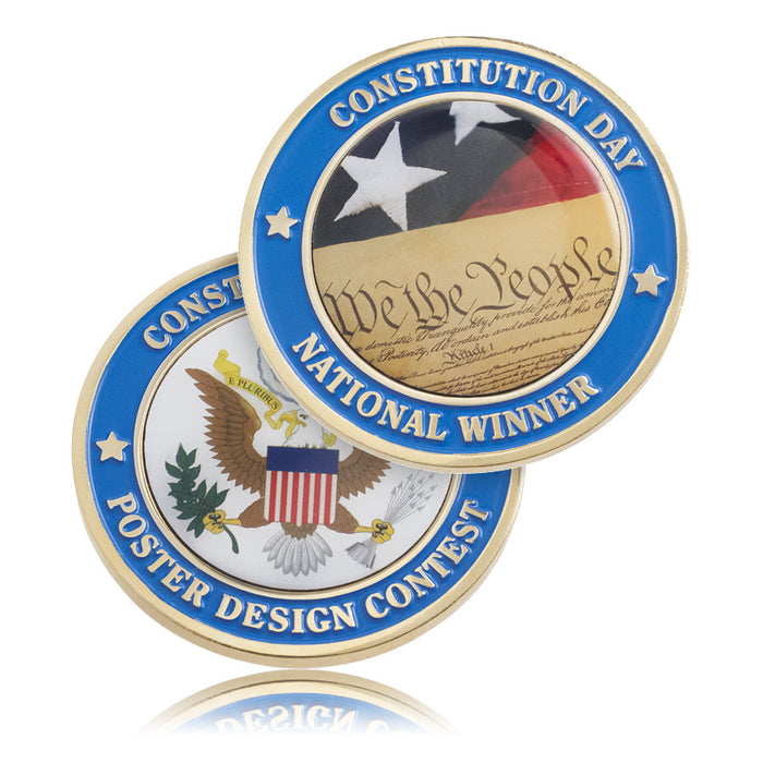 Two coins with 'Constitution Day' and 'Poster Design Contest' and full color graphics on a white background