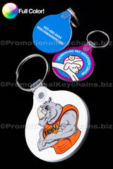 A collection of round vinyl keychains with a tab, featuring various full-color imprints including a cat and dog design and a rhino in a tank top.