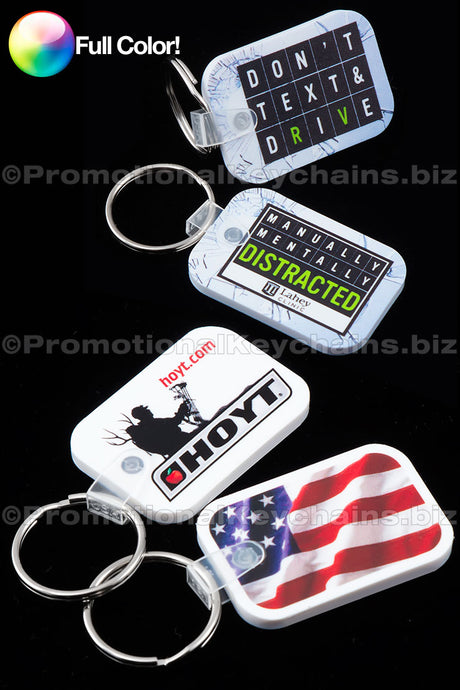 A set of full color don't text and drive vinyl keychains in various designs including a silhouette of a person, a dog, and an American flag.