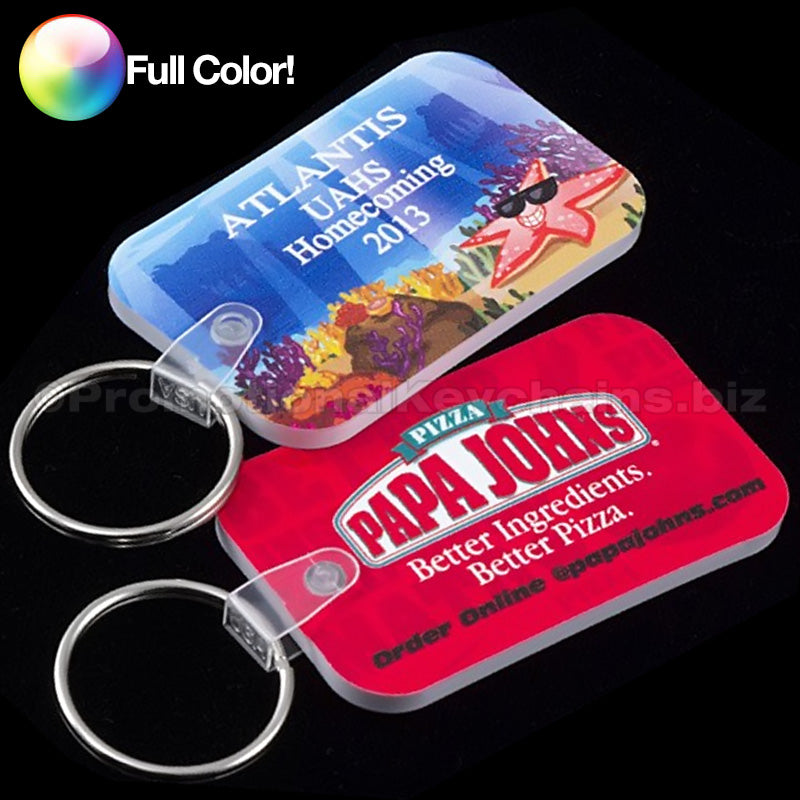 A set of full-colored vinyl keychains with various designs, including a Papa Johns pizza keychain and Atlantis UAHS.
