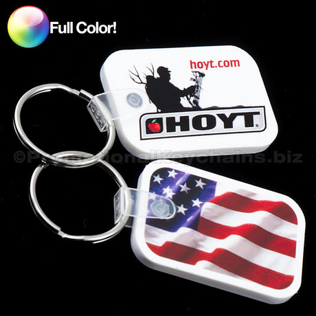 A set of full color vinyl keychains in various designs including a silhouette of a person and the HOYT logo and an American flag.