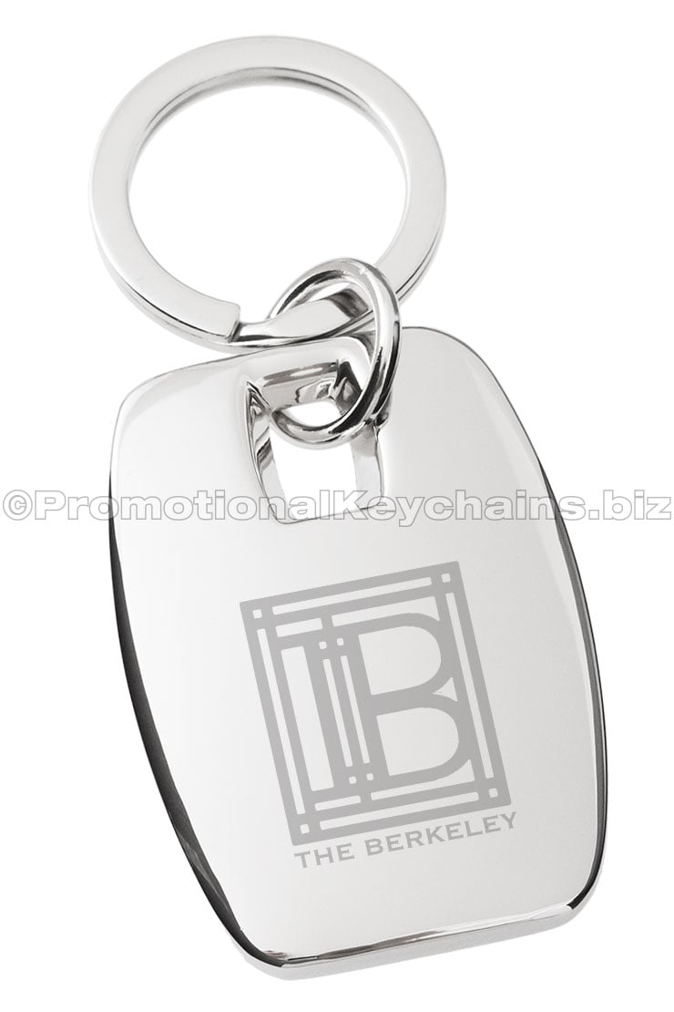 A polished metal rectangular keychain with the logo for "The Berkeley" engraved in the center.