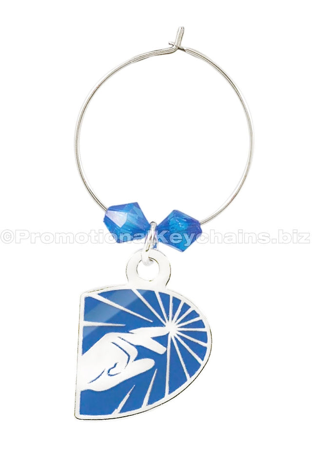 A polished nickel wine glass charm featuring a blue D-shaped pendant with a stylized hand reaching toward a star and adorned with blue beads.