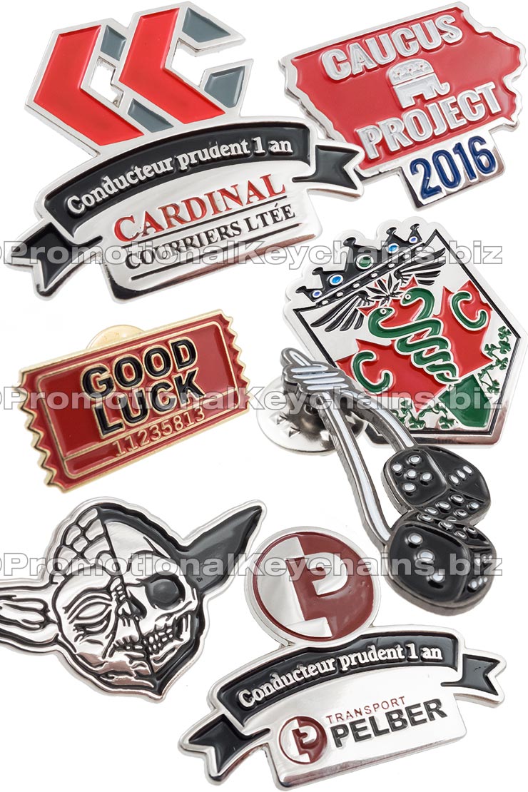 Group of Value Series, soft enamel, Classic Die Struck lapel pins showing different colors and shapes. 
Designs include a silver and black Yoda pin, Gold and red ticket pin, and shield shaped pin with green snakes on it. 