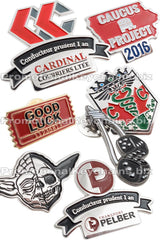 Group of Value Series, soft enamel, Classic Die Struck lapel pins showing different colors and shapes. 
Designs include a silver and black Yoda pin, Gold and red ticket pin, and shield shaped pin with green snakes on it. 