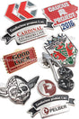 Group of Value Series, soft enamel, Classic Die Struck lapel pins showing different colors and shapes. 
Designs include a silver and black Yoda pin, Gold and red ticket pin, and shield shaped pin with green snakes on it. 