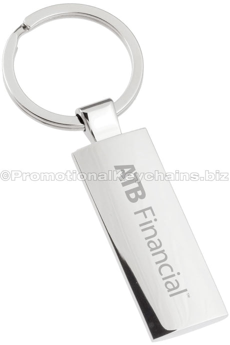 A rectangular polished metal keychain with "ATB Financial" engraved down the center.