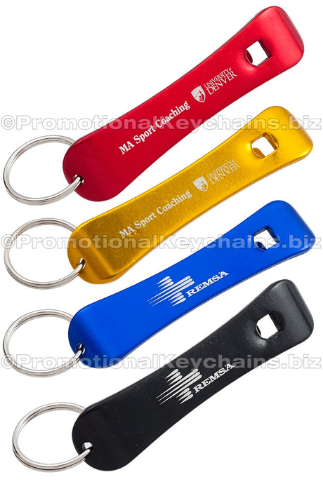 Image shows four Snowboard Bottle Opener keychains. They have engravings showing custom branding. Colors of bottle openers red, gold, royal blue and black. 